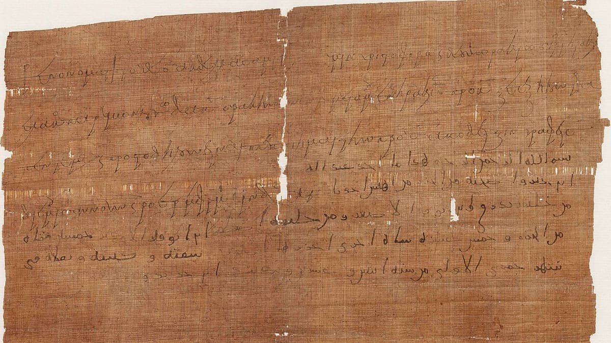 Bilingual Greek and Arabic papyrus receipt, PERF 558, with Greek lines down the left and across the upper right and five lines of Arabic at the lower right