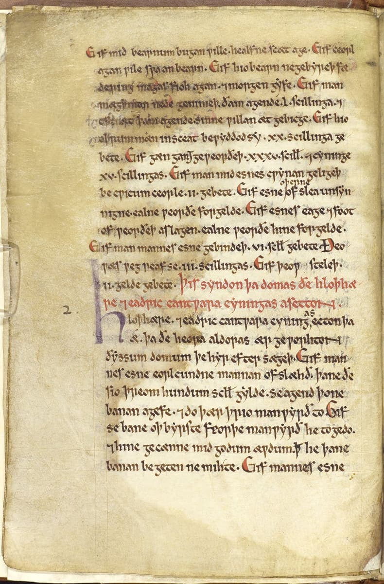 Folio of the Textus Roffensis with Old English law clauses, a red rubric across two lines and a large purple initial H