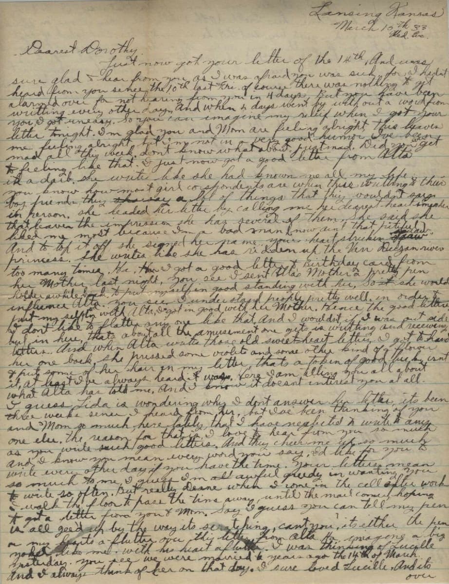 A closely written 1933 letter in sloping ink cursive, with several words struck through and the catchword “over” at the foot of the page