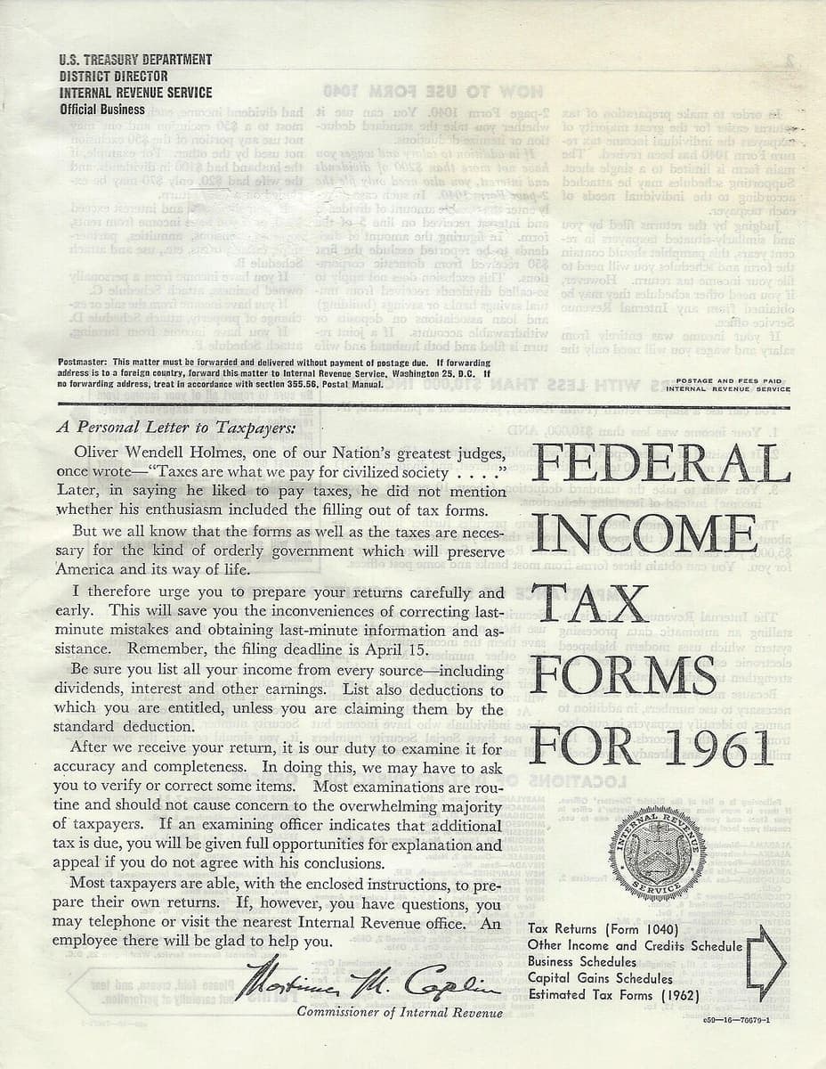 The cover of the 1961 US federal income tax forms mailing, with mirrored text from the reverse showing through the paper and fold creases across the page