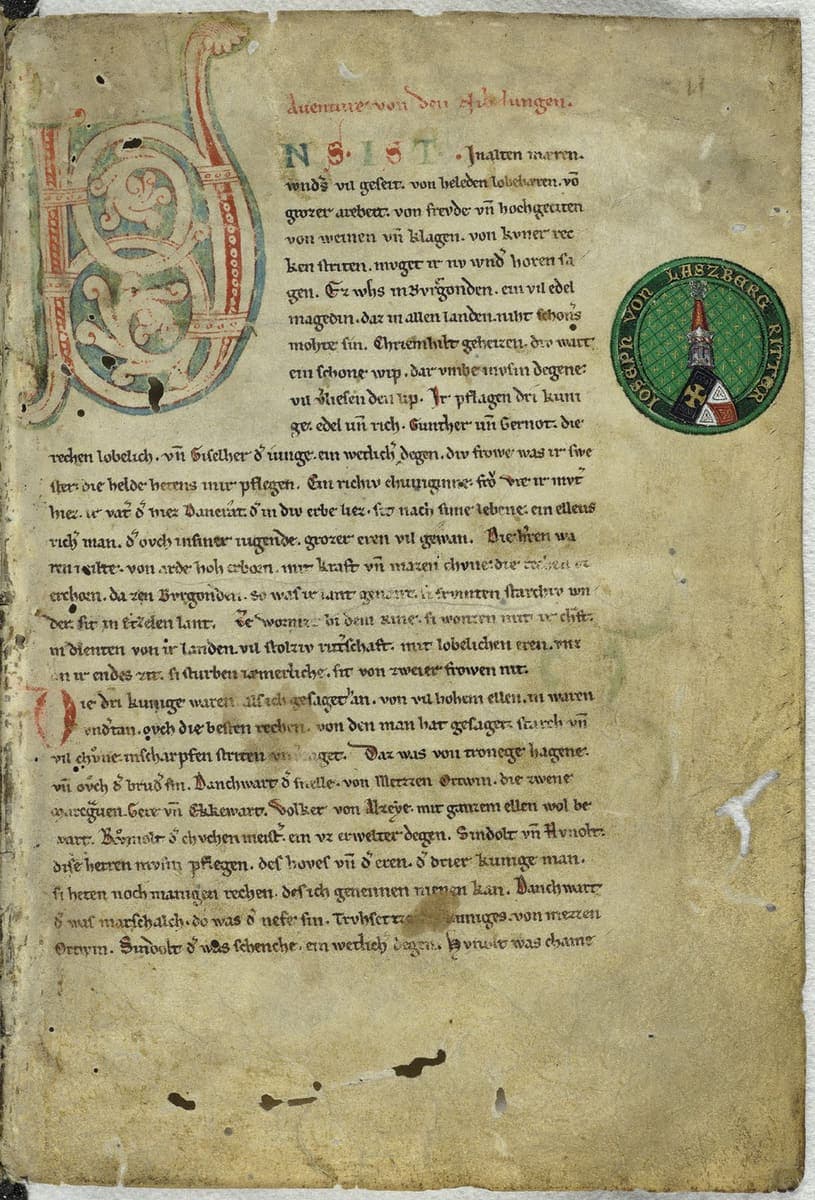 Opening page of a Nibelungenlied manuscript with a red heading, a large blue and red initial, and long lines of thirteenth-century book hand