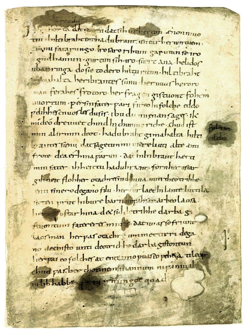 Damaged parchment leaf of the Hildebrandslied in a rapid ninth-century minuscule, showing water stains and a runic-derived wynn letter