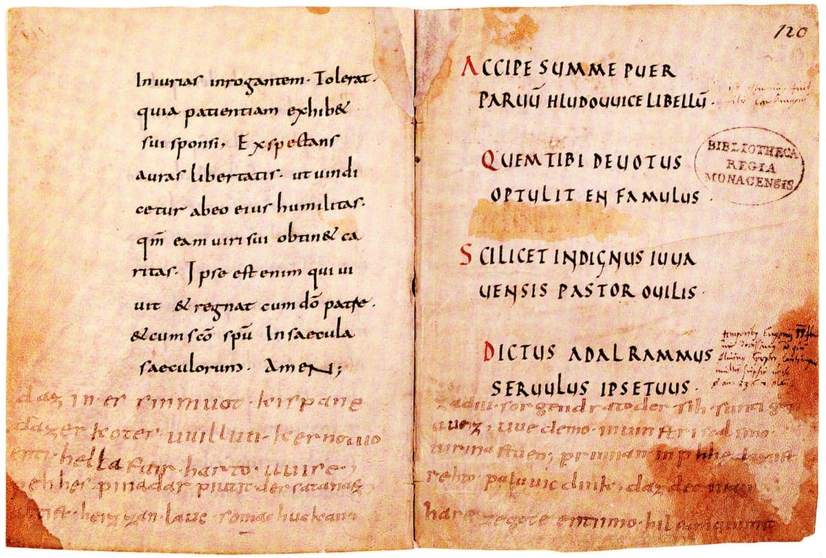 Open double page of a Latin devotional manuscript with a rougher Old High German poem in reddish ink added along the bottom margin of both leaves