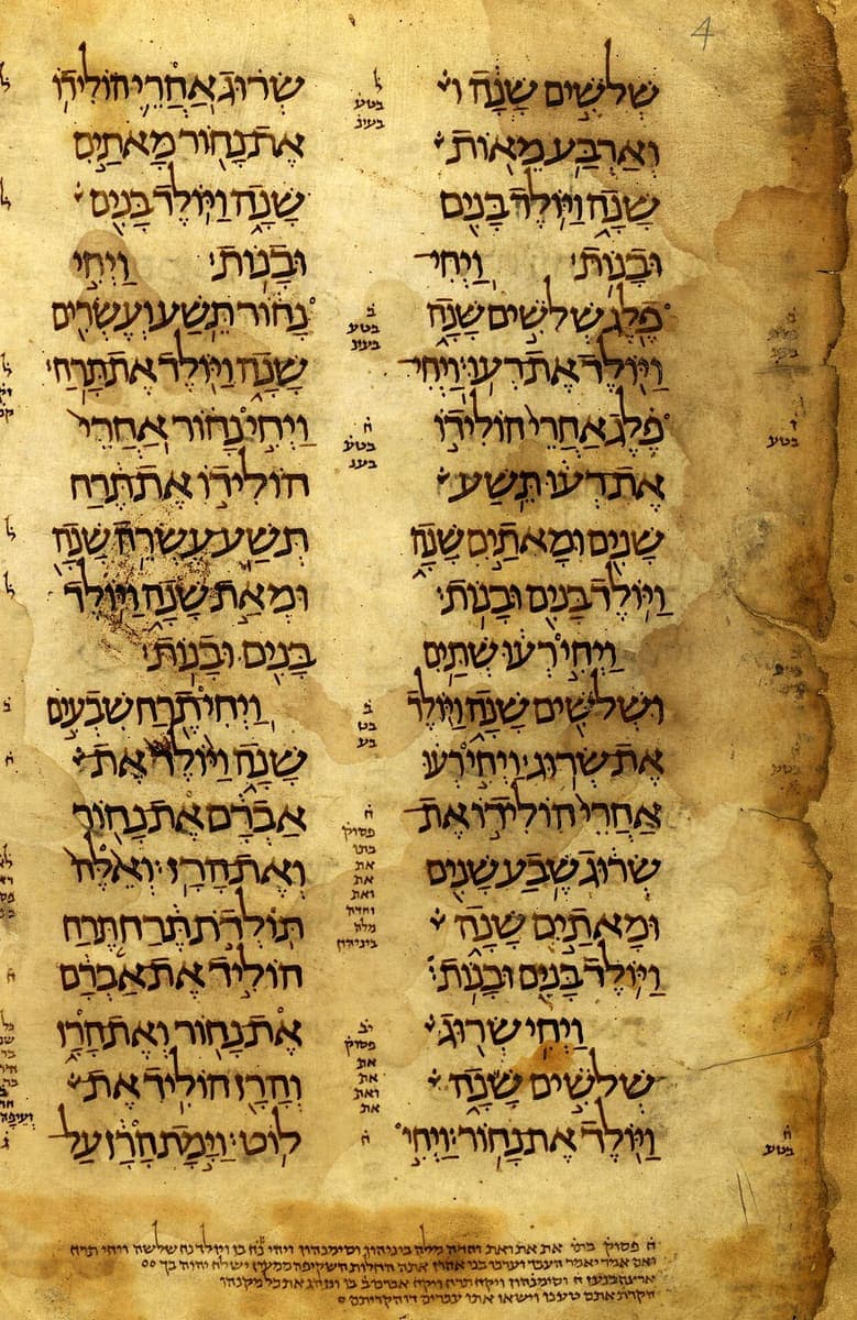 Two stained parchment columns of large Oriental square Hebrew with vowel points, and faint marginal notes at the outer edge