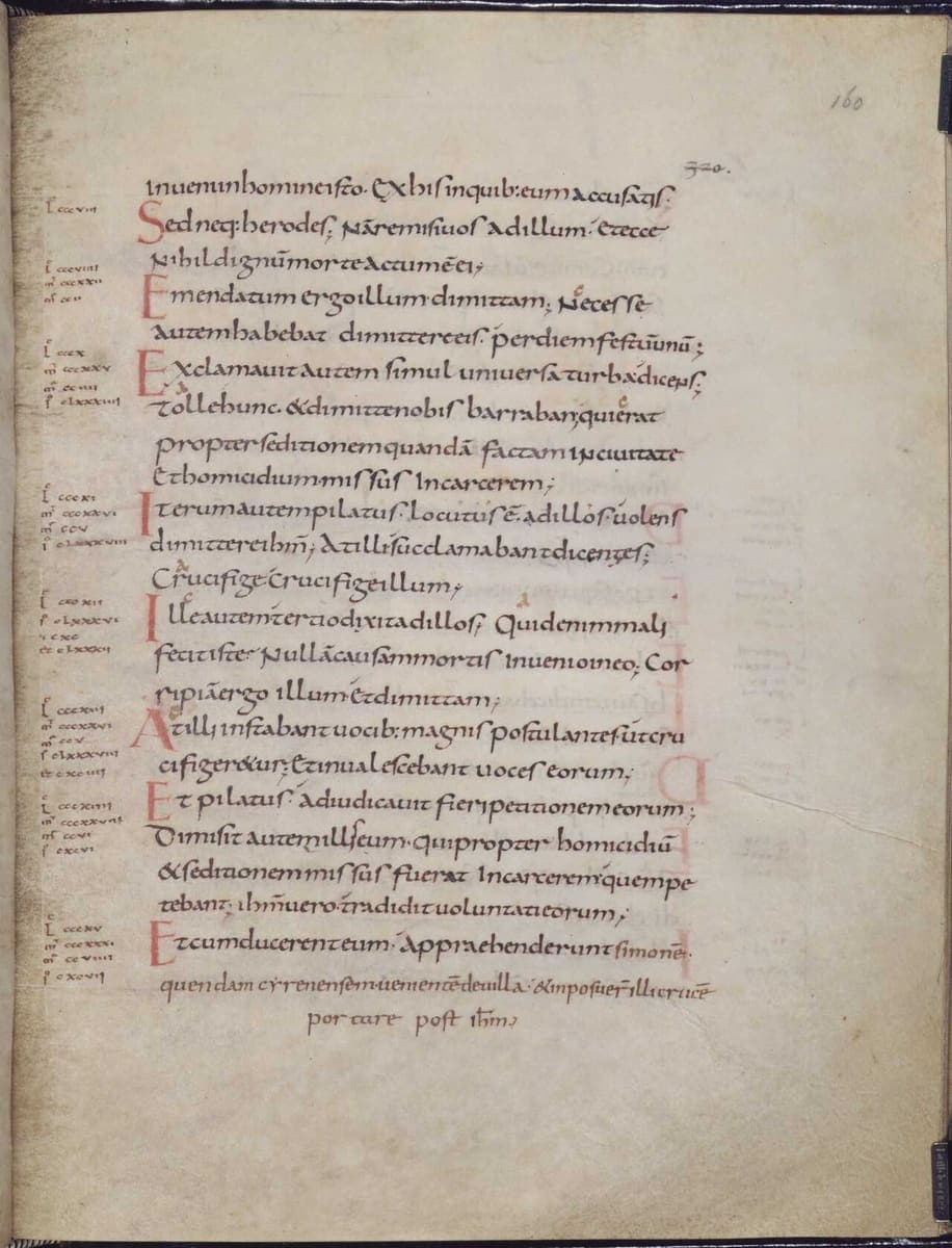 Single-column Carolingian minuscule Gospel page with red section initials and marginal canon-table numbers