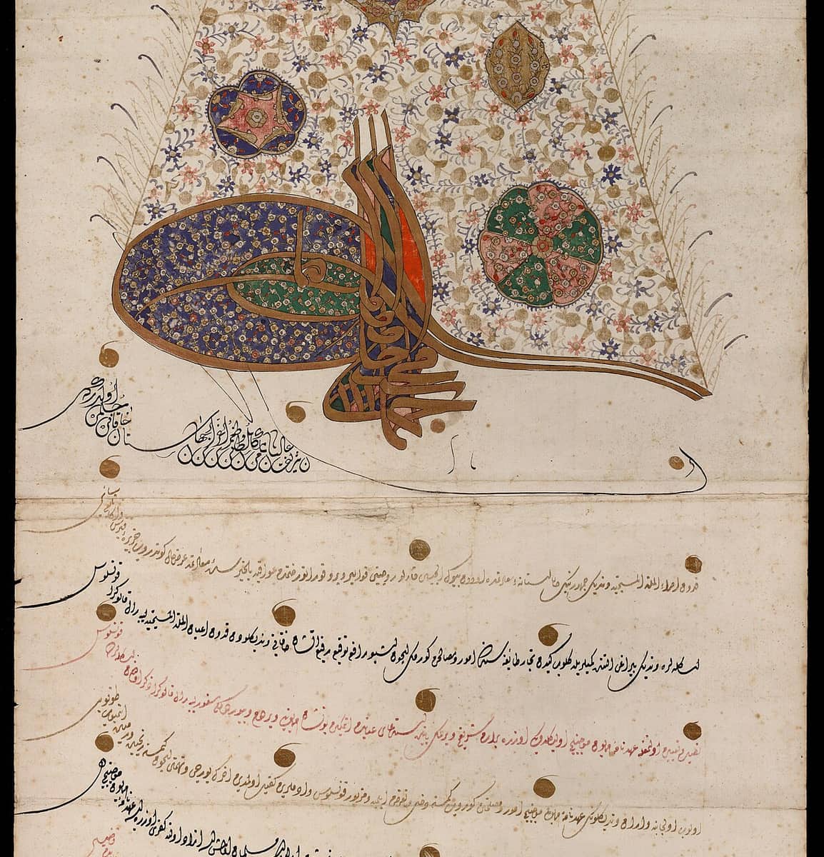 Upper part of a long Ottoman scroll: an illuminated tughra in gold and blue on a flowered ground, with rising lines of black and red chancery script and gold dots below