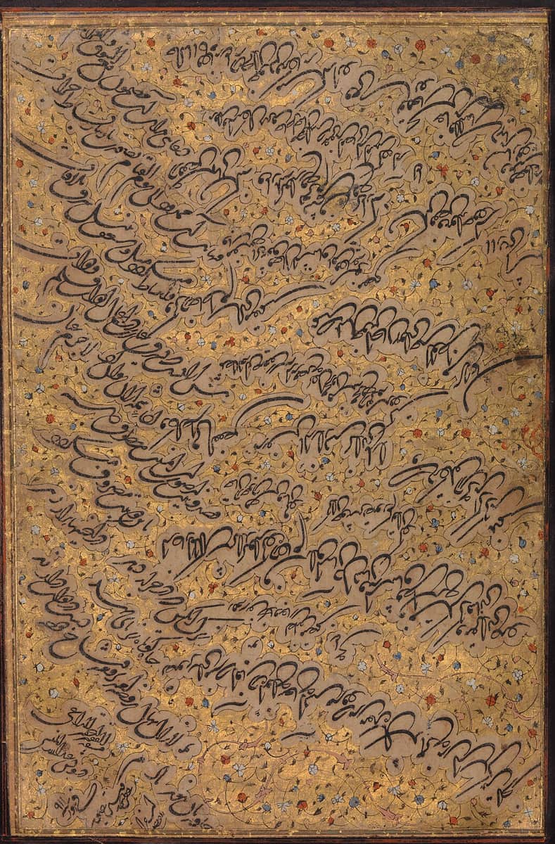 Letter written in bold sloping script on gold paper scattered with painted flowers, the lines rising towards the left
