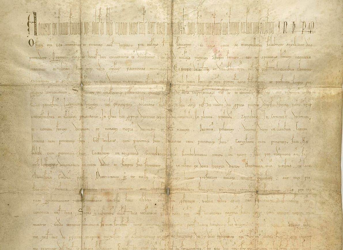 Upper half of a papal privilege of 1155 on parchment, wide-spaced late Caroline minuscule with abbreviation strokes and a line of tall display letters at the top