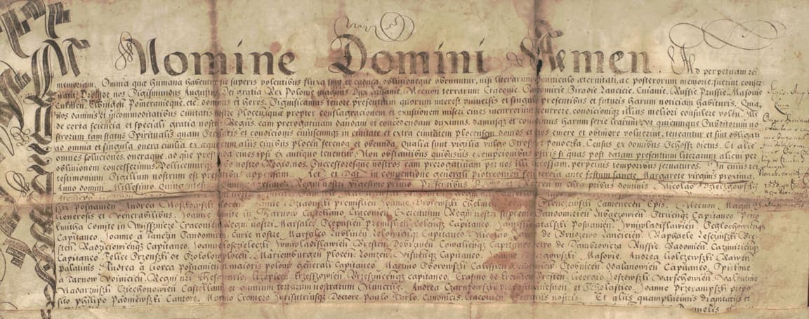 Royal privilege of 1550 with a tall calligraphic display line reading In Nomine Domini Amen, a flourished left margin and small chancery cursive below in two blocks