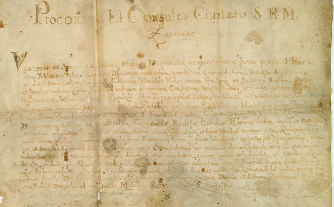 Stained seventeenth-century certificate on parchment, headed in large looping capitals, with a wide italic hand below and brown damp marks across the lower half