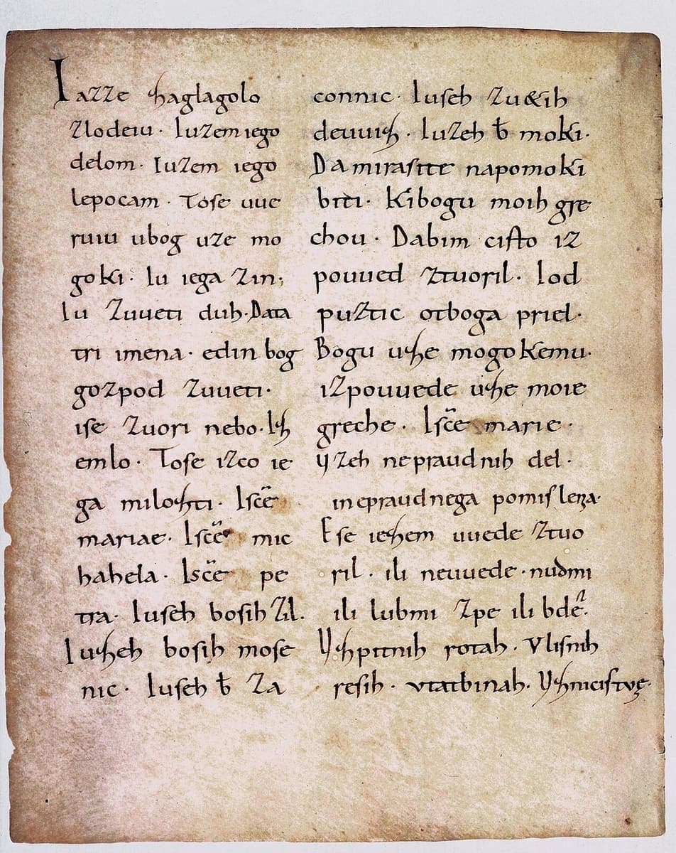Parchment page of the Freising Manuscripts with two columns of tenth-century Carolingian minuscule in brown ink