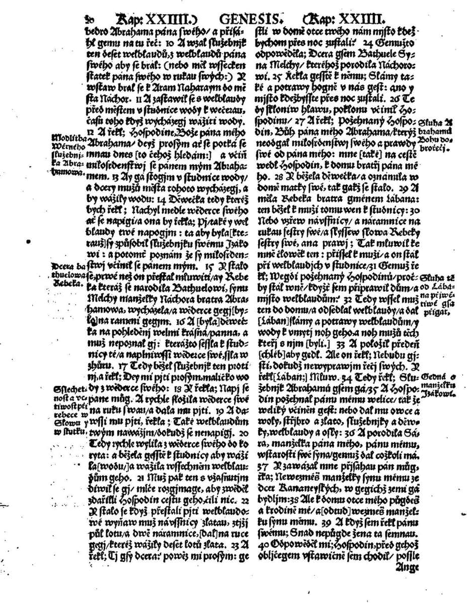 Two columns of dense Czech blackletter print with verse numbers, a running head reading GENESIS and small marginal notes in the outer margins