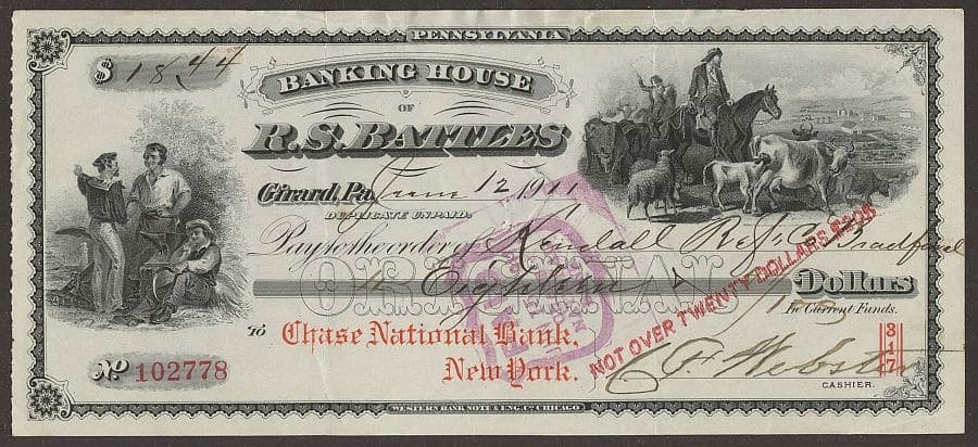 An ornate 1911 American bank draft with engraved vignettes, a red diagonal overprint reading NOT OVER TWENTY DOLLARS and a handwritten amount