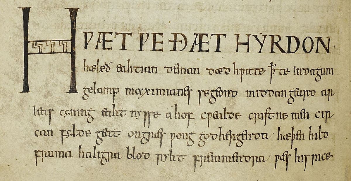 Opening lines of Cynewulf’s Juliana in the Exeter Book, folio 65v, with HWÆT WE ÐÆT HYRDON in decorated capitals