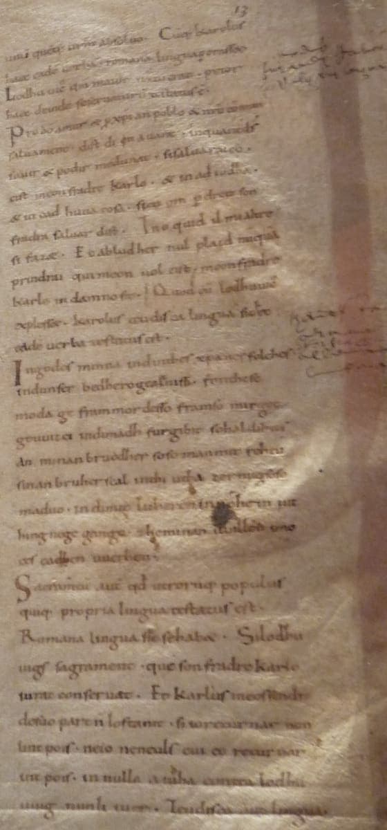 Folio 13r of BnF MS lat. 9768, Nithard’s Histories, with the Romance and German oaths of Strasbourg in Caroline minuscule and later marginal notes