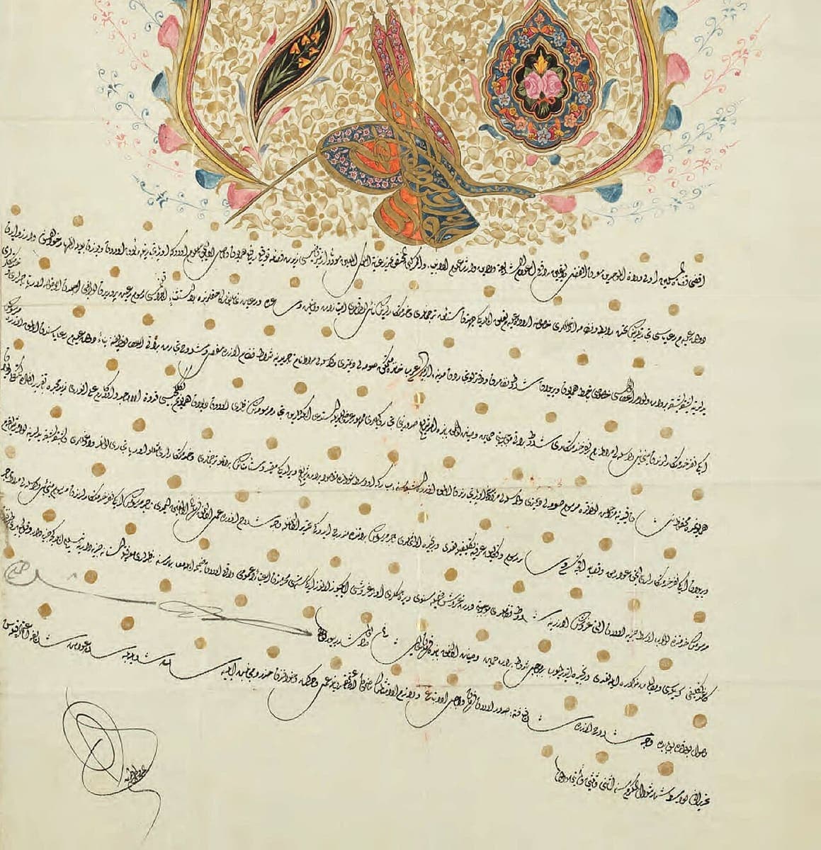 Illuminated ferman with a gilded tughra inside a painted floral cartouche above nine widely spaced rising lines strewn with gold dots