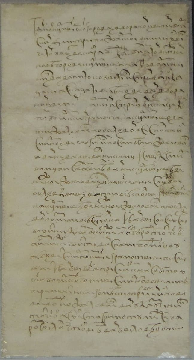 Tall narrow strip of paper carrying about twenty-five lines of looping early seventeenth-century Russian cursive