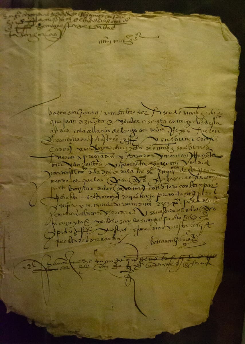 A single sheet of sixteenth-century paper whose address line is drawn out into a long horizontal flourish above sixteen looped lines.