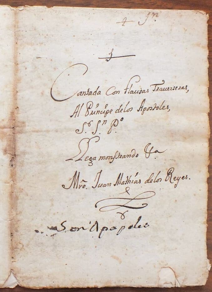 The right-hand leaf of a paper wrapper inscribed with five lines of an eighteenth-century hand ending in a large flourish.
